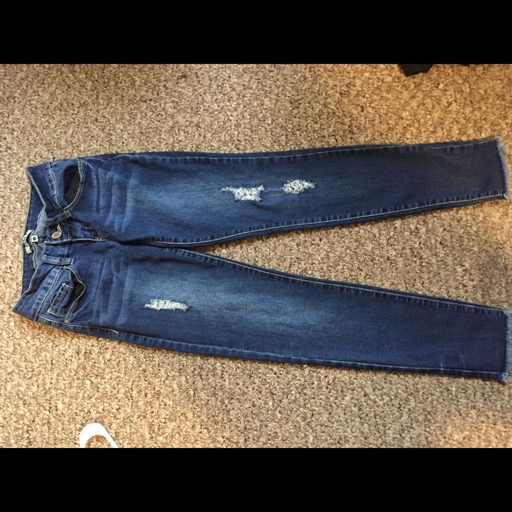 Distressed fringed skinny jeans